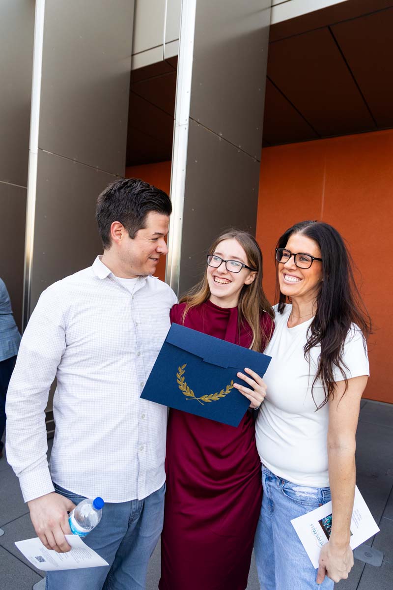 Student posing with her family
