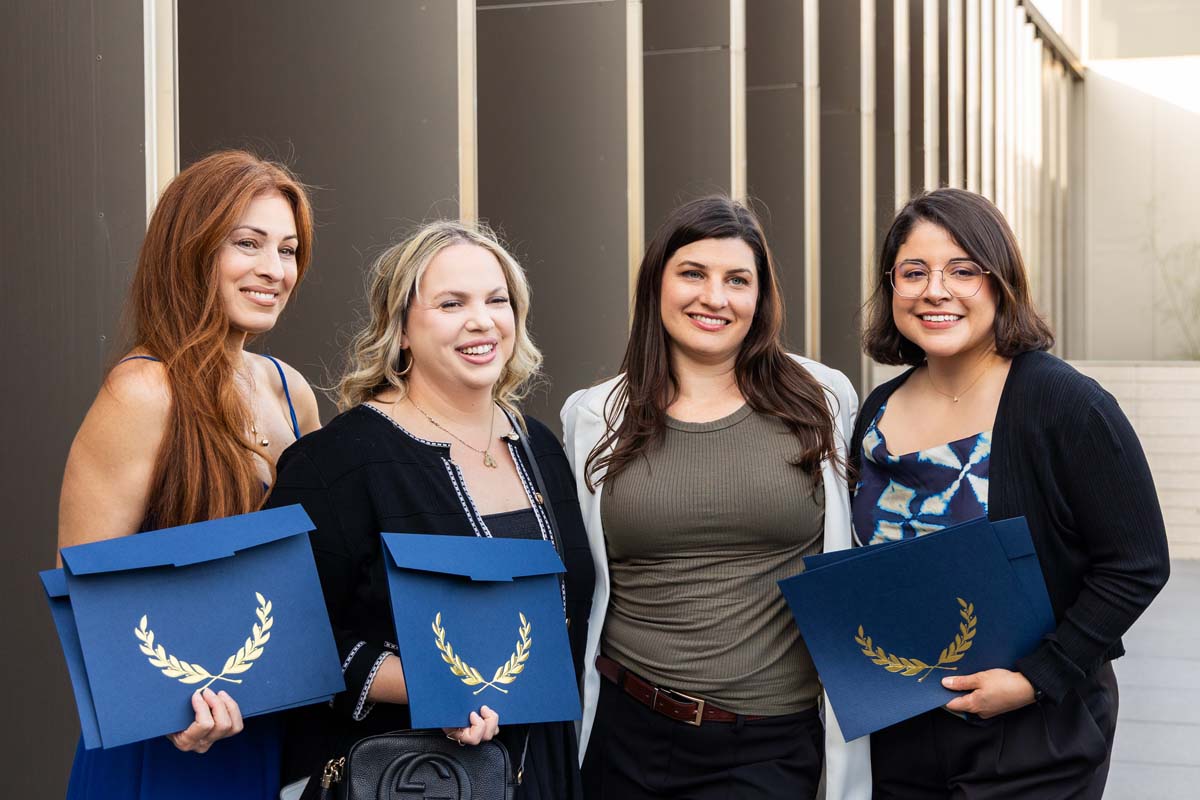 Four graduates together