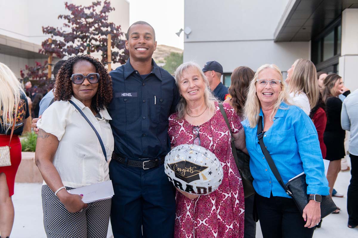 Cadet taking family photo after ceremony