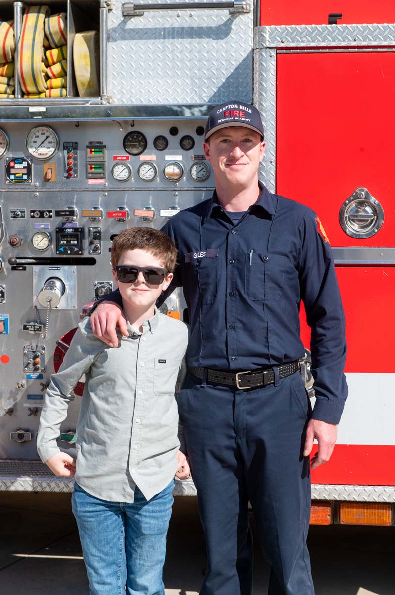Cadet and family member posing for a photo