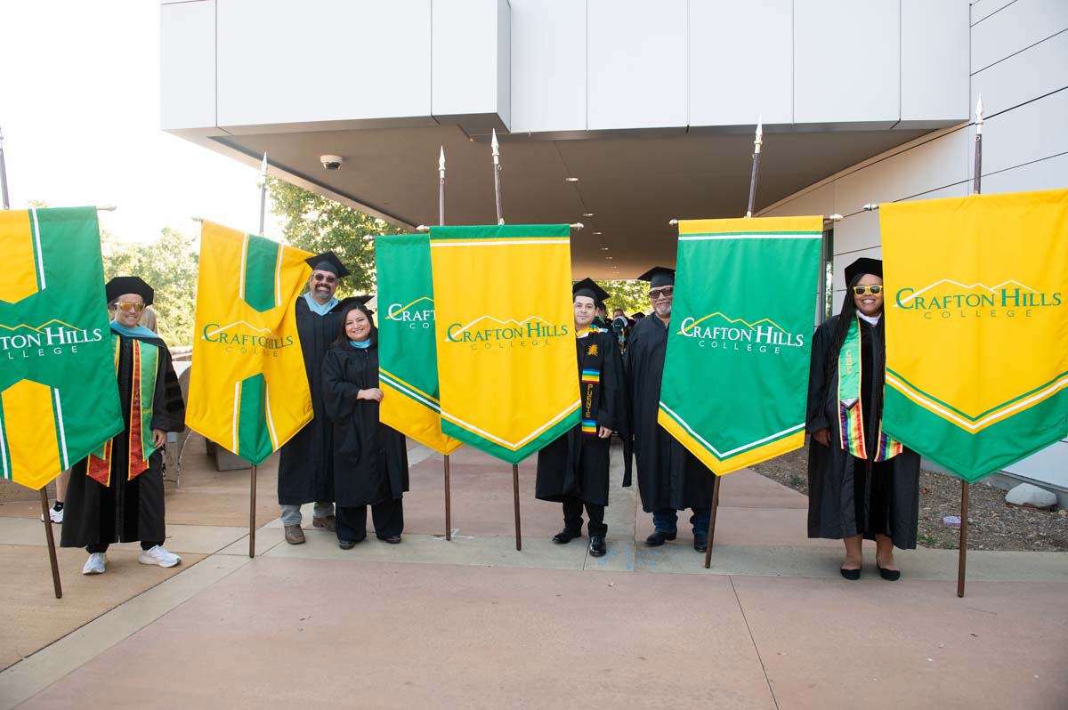 Faculty with Crafton flags