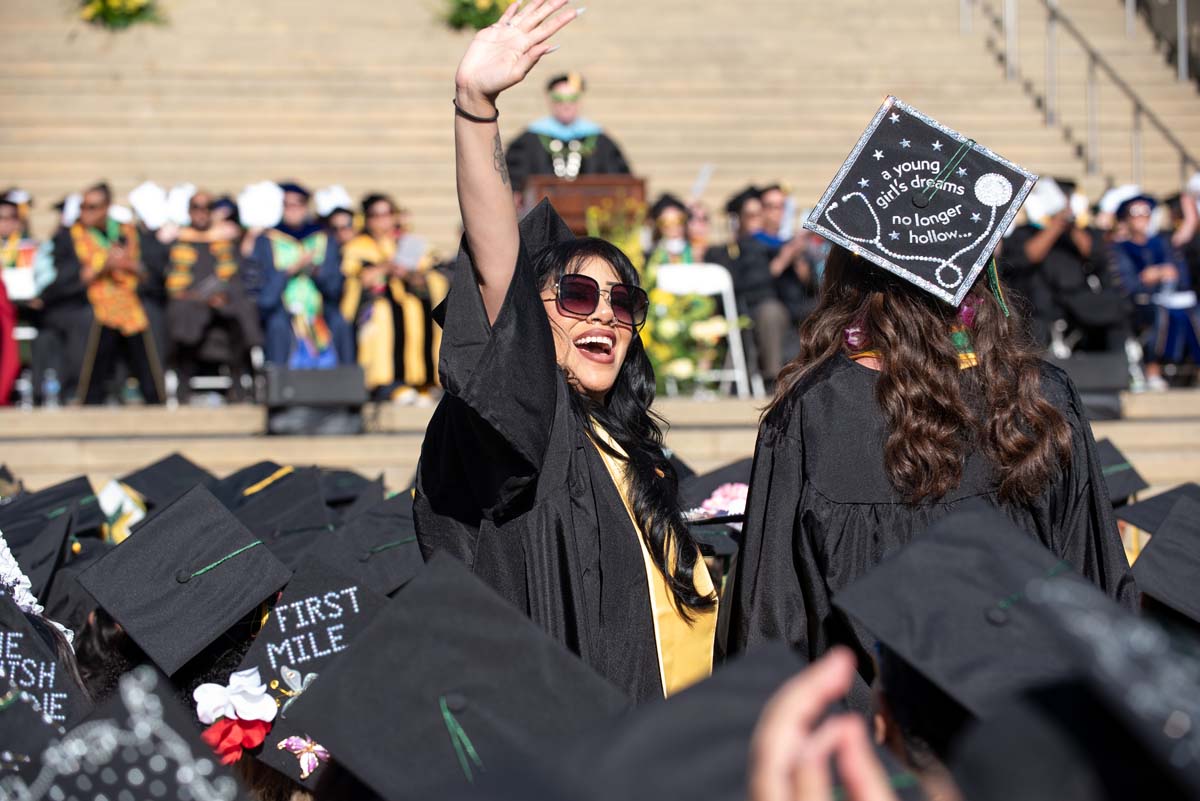 Grad waving at family