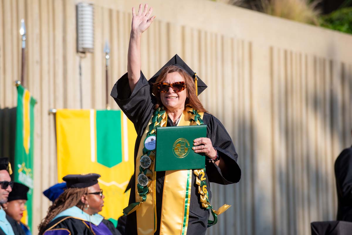 Grad waving at family