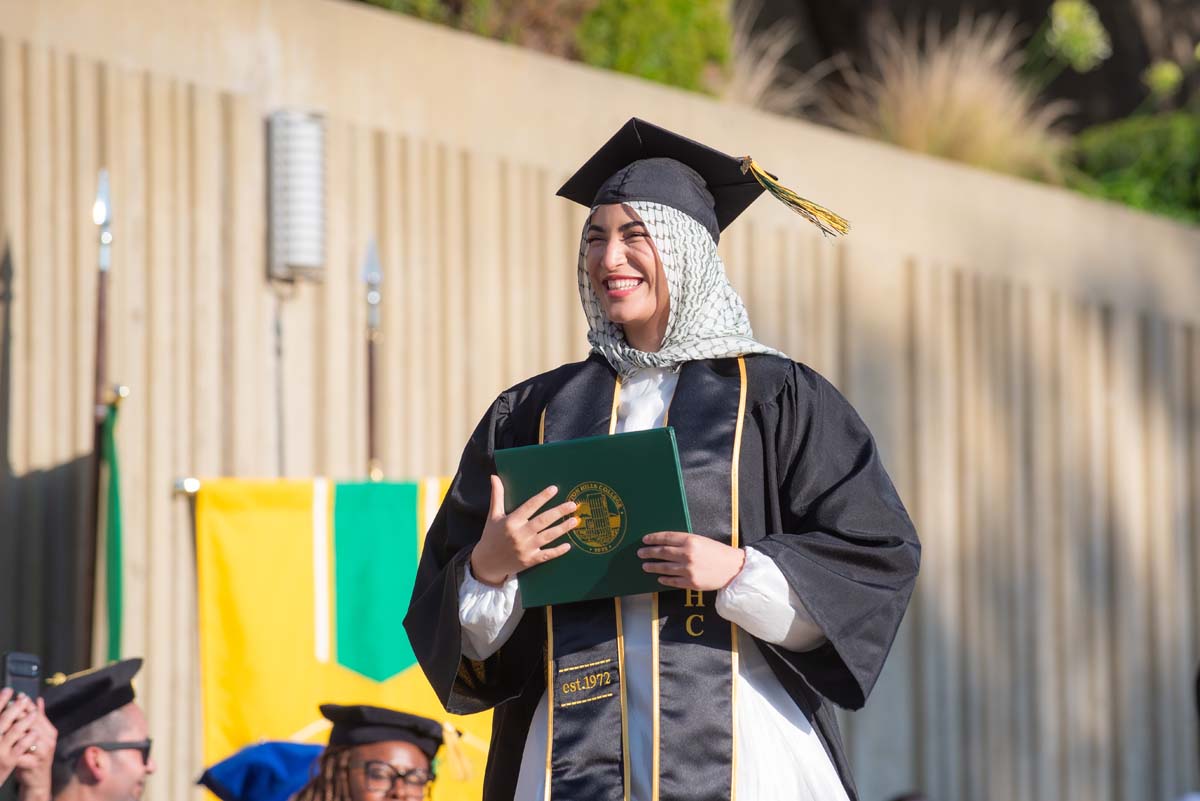 Grad walking across stage