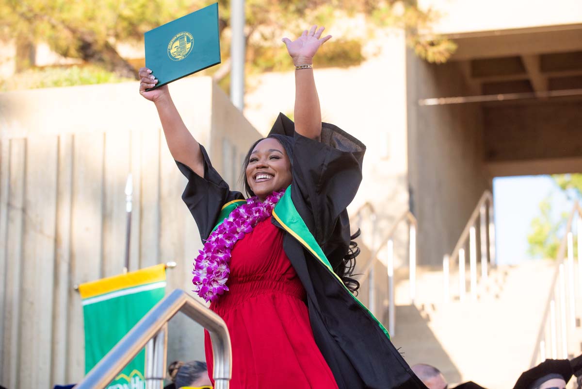Grad walking across stage