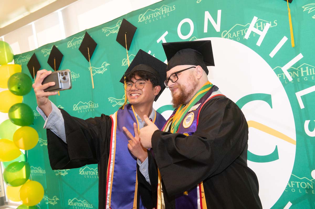 Two graduates taking a selfie