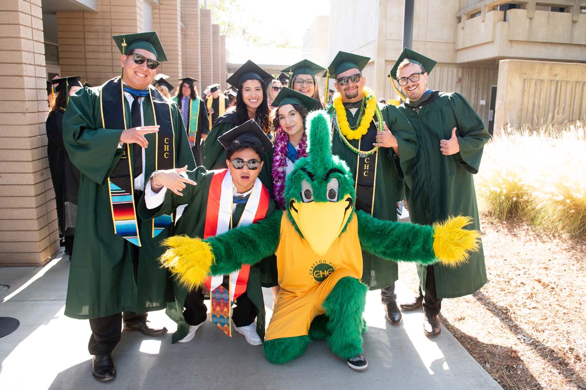 Group of grads with Ryker outside