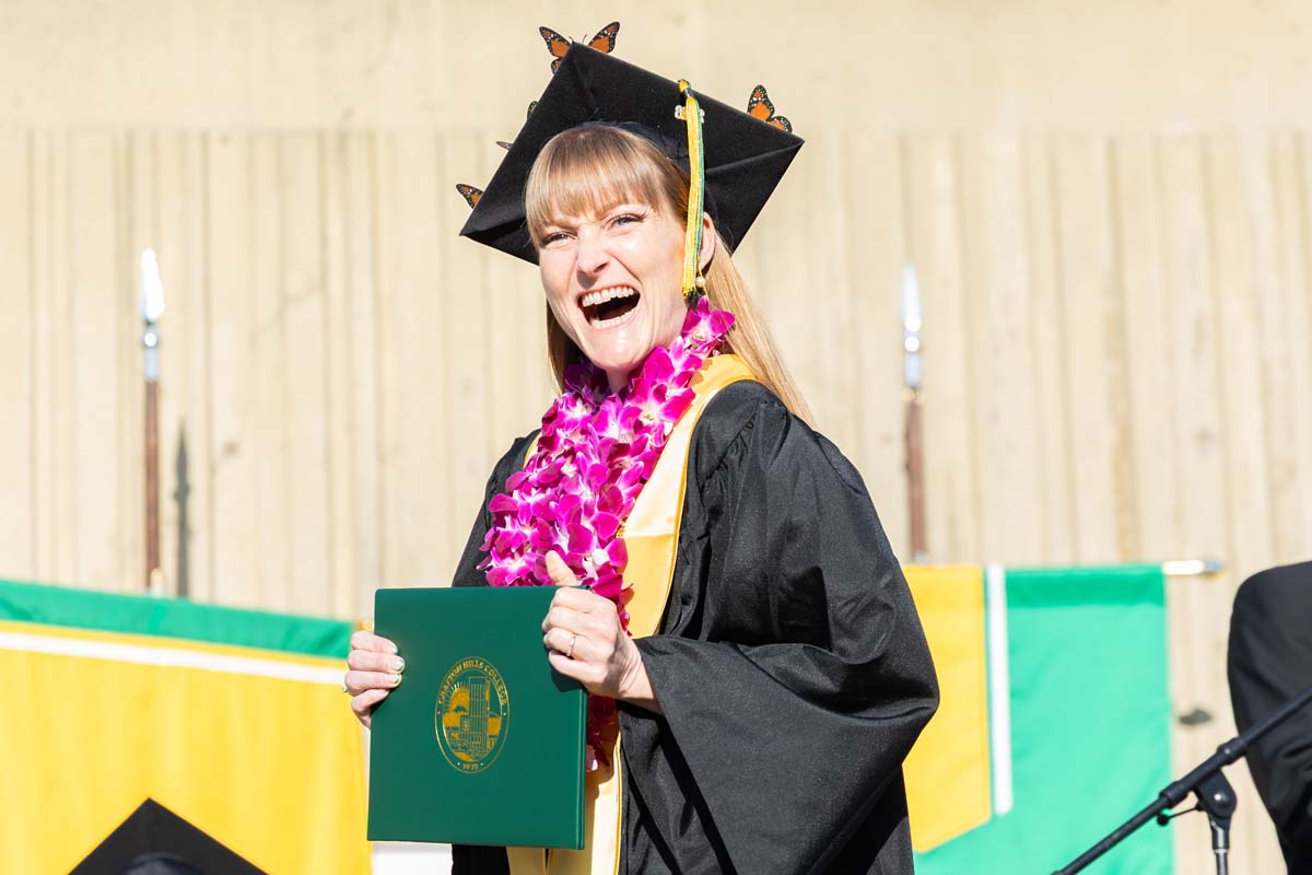 Grad walking across the stage