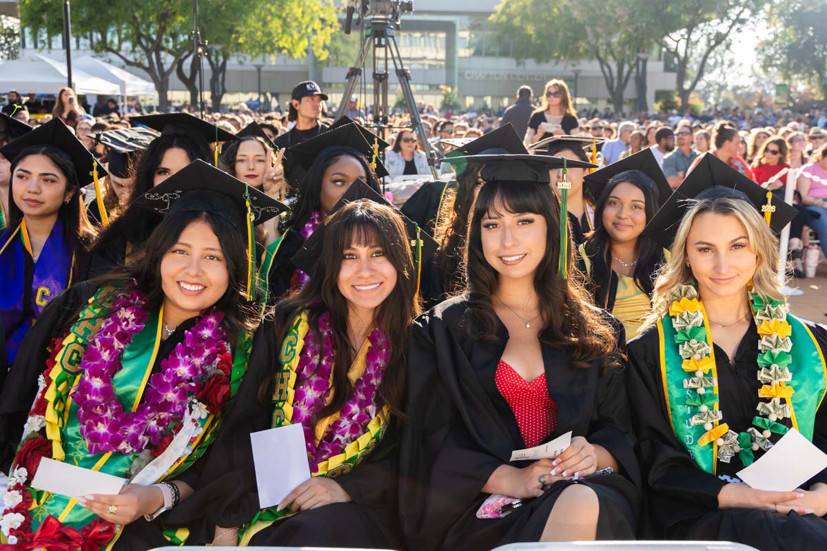 Four grad posing
