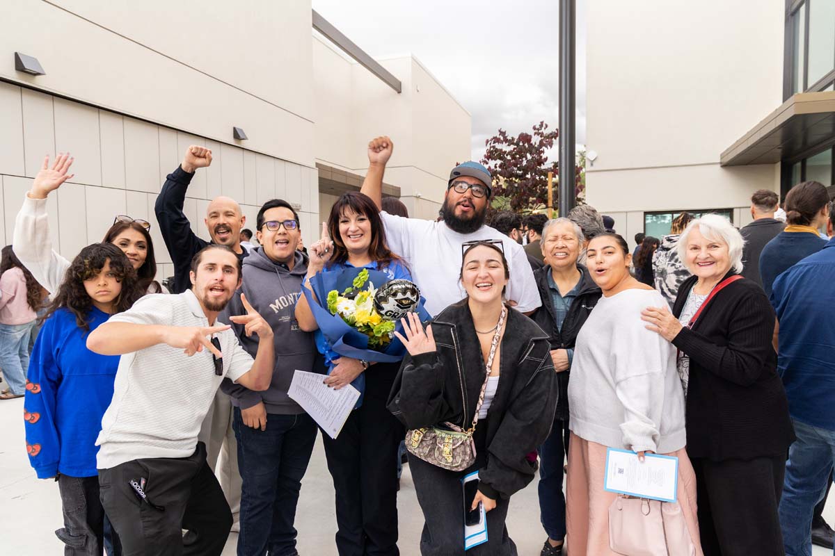 Family cheering with grad