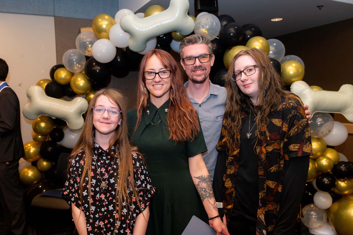 Grad with their family