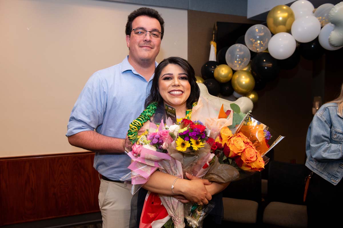 Grad with staff