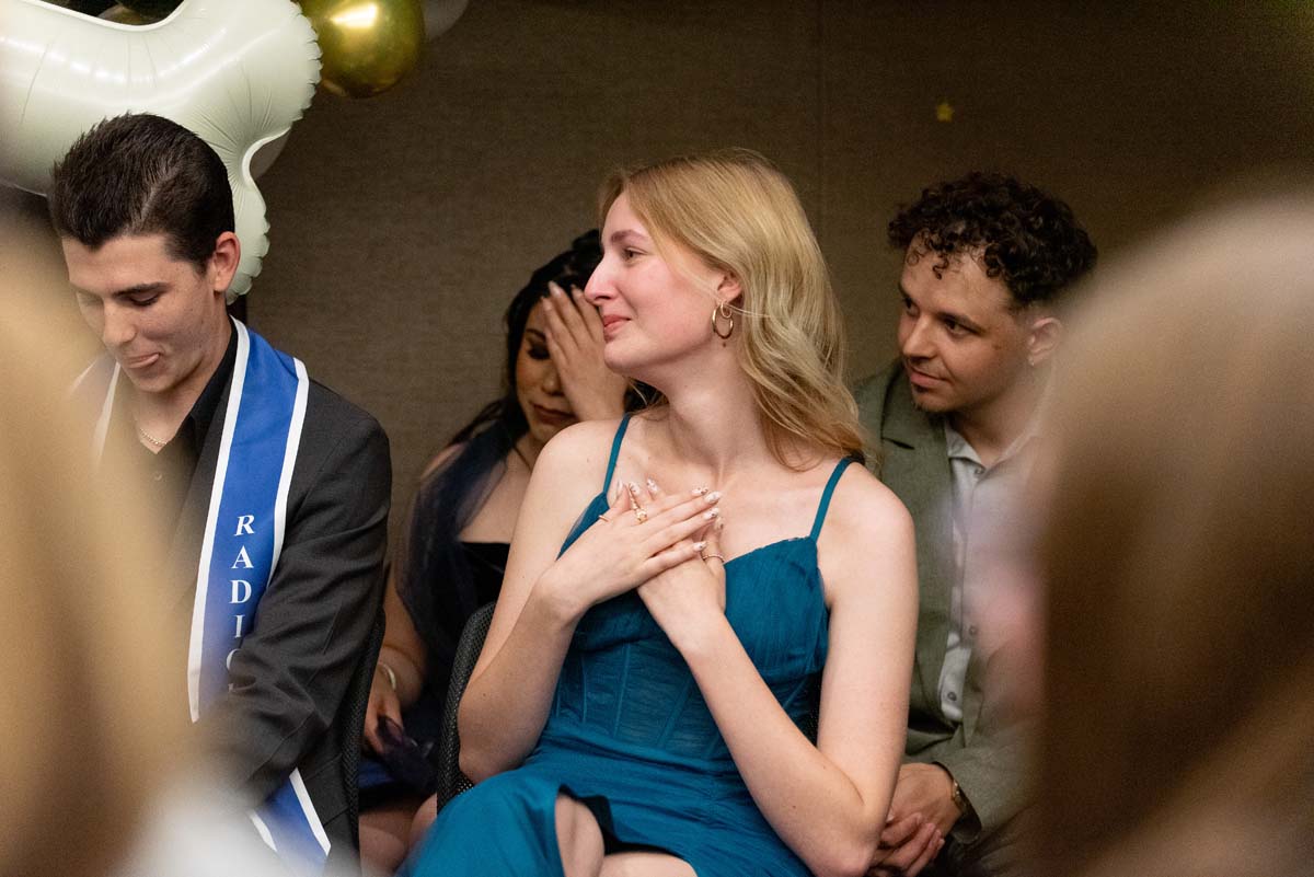 Grad smiling at speaker