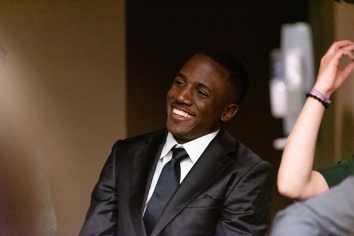 Grad smiling at speaker