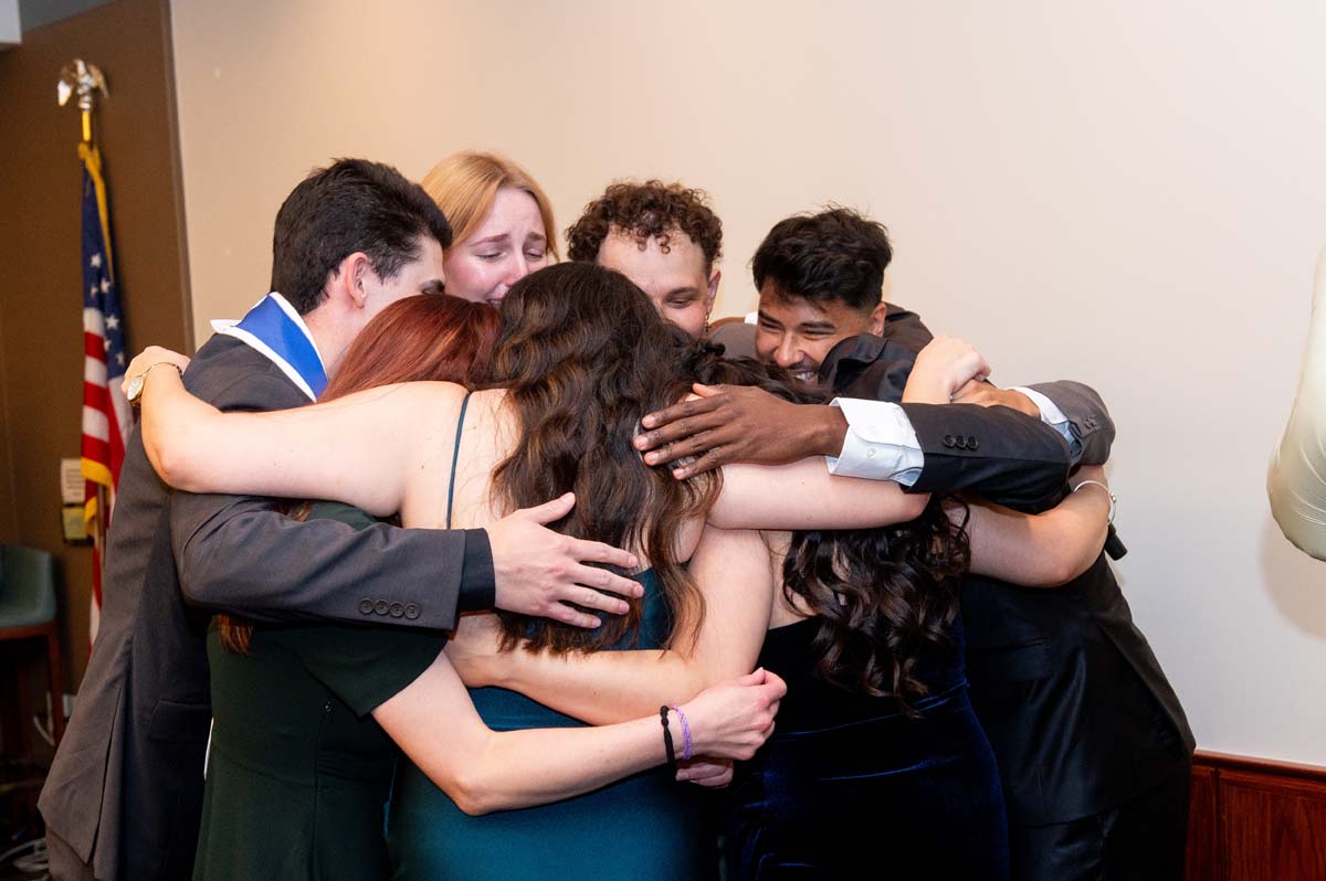 Grads group hug