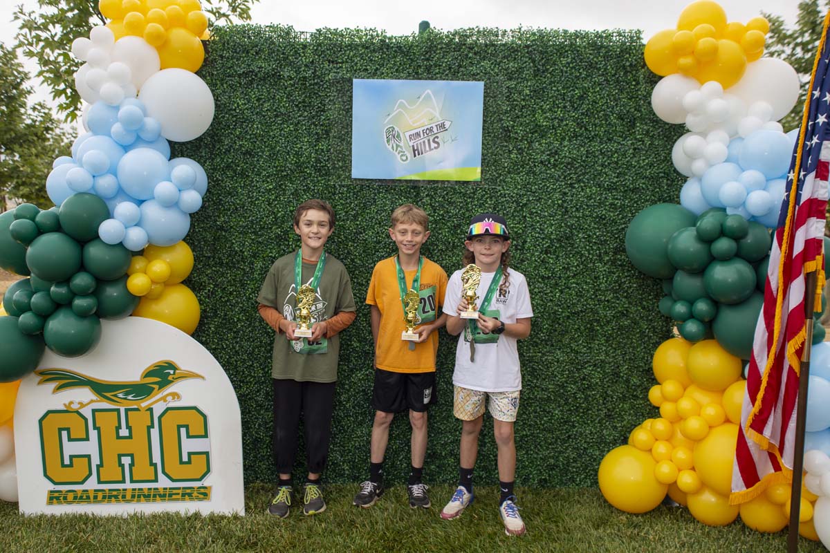 Three reaces with trophies