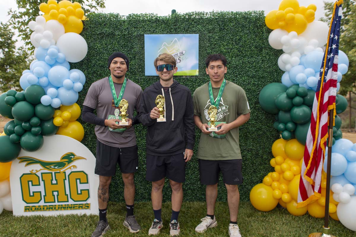 Three racers with trophies