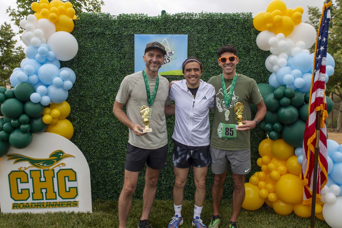 Three racers with trophies