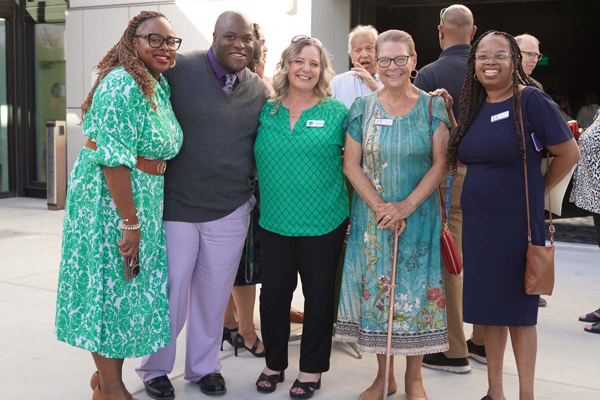 Five people posing for photo at MultiChamber Mixer
