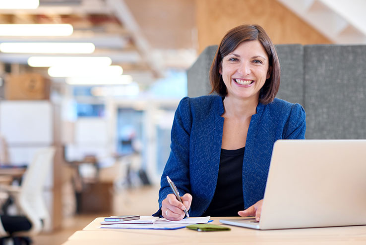 Woman sitting at laptop