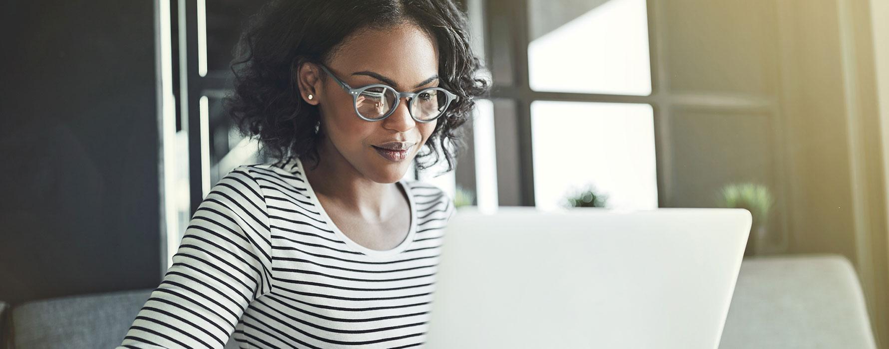 Woman sitting at laptop