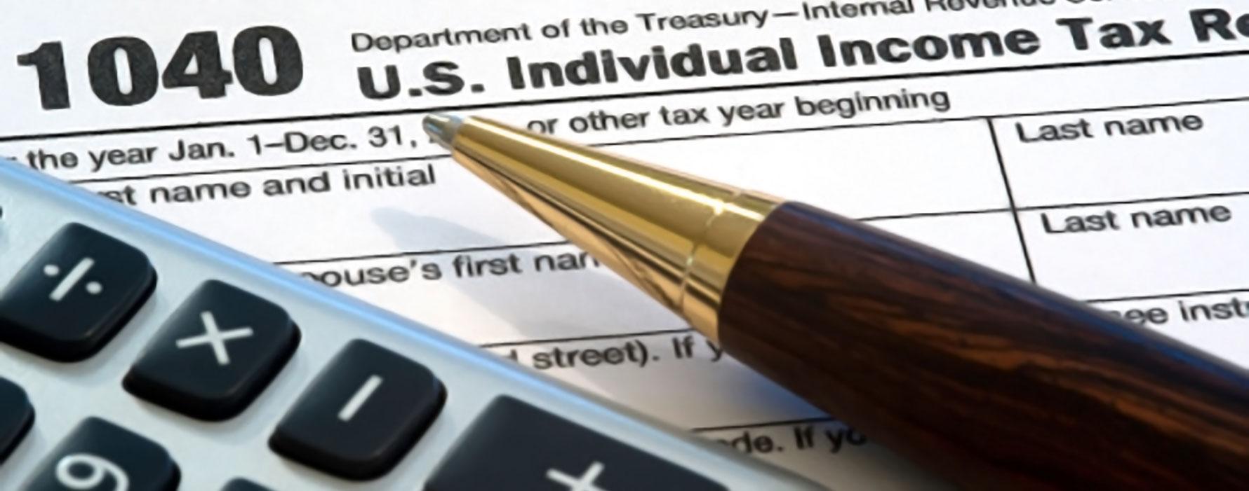 Pen and calculator with tax form