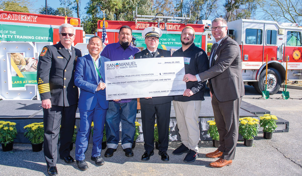 People holding a giant check