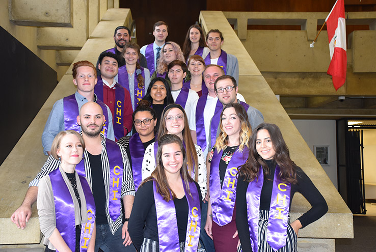 Honors graduates on stairs