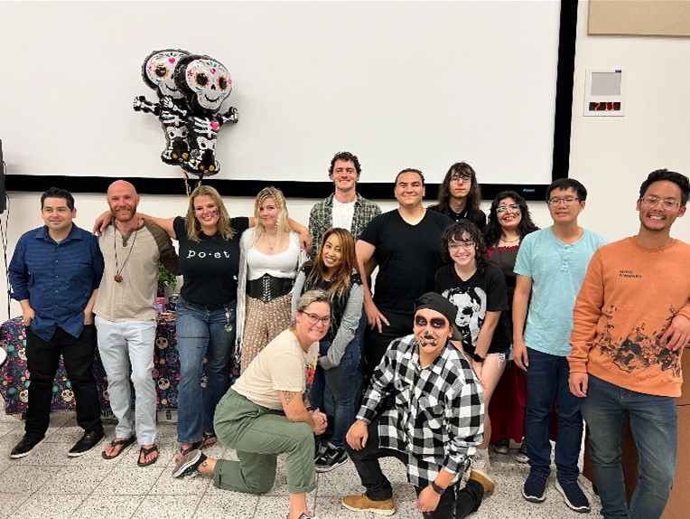 Faculty and students at the Dia de Los Muertos celebration.