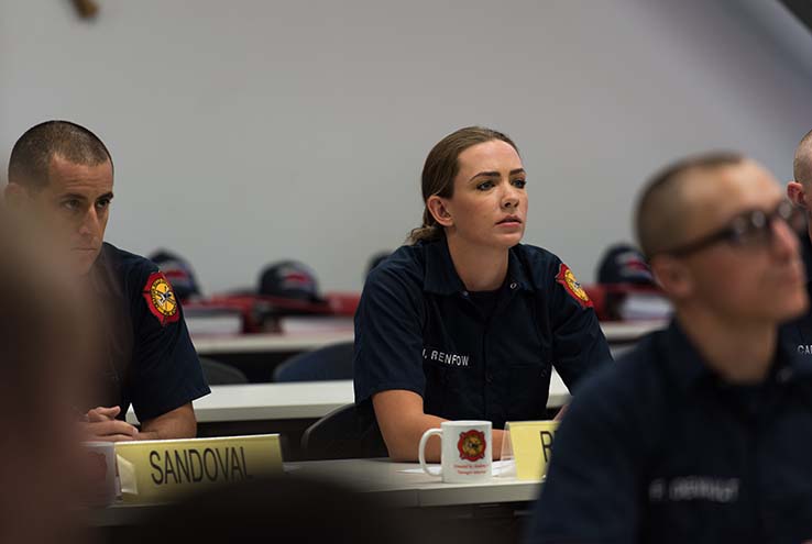 Female student in firefighter training class