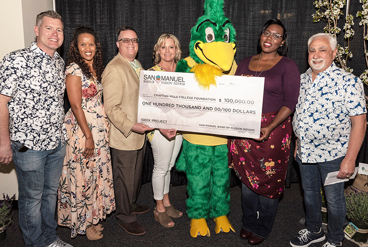 Group holding the check from San Manuel