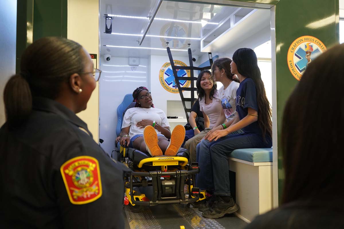 Girl Scouts sitting in ambulance