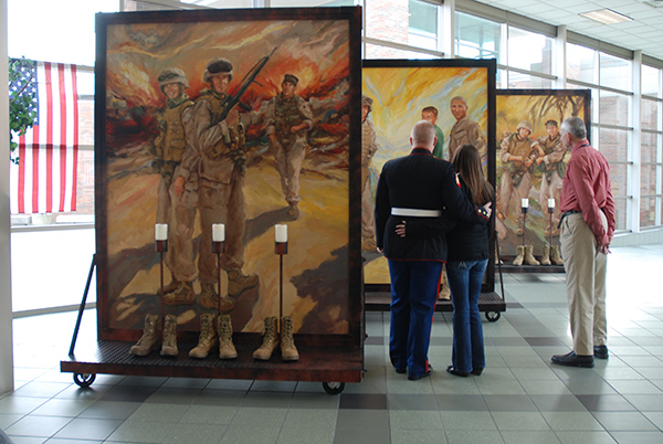 Large paintings of people in military uniforms and observers