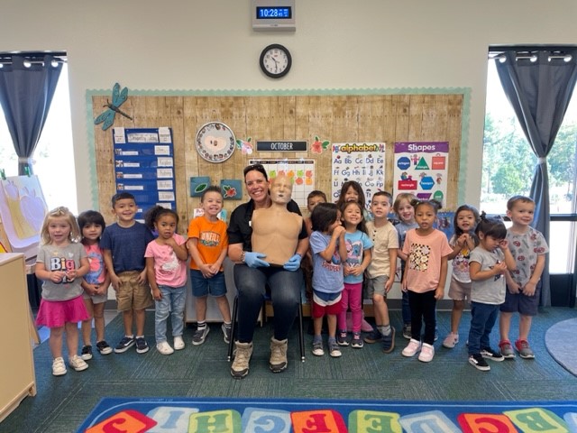 Children and instructors with safety dummy