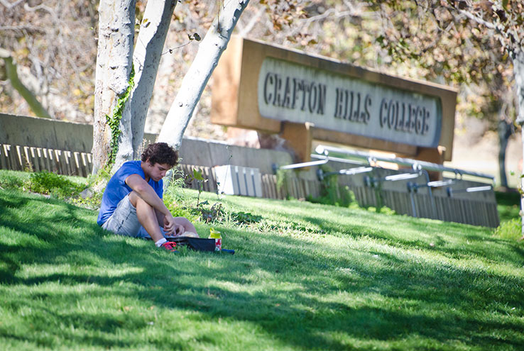 Student sitting on campus