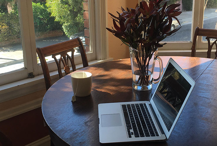 Laptop and tea on a table