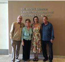 People bneather sign reading "Dr. Daniel Bahner Center for Innovative Teaching and Learning"